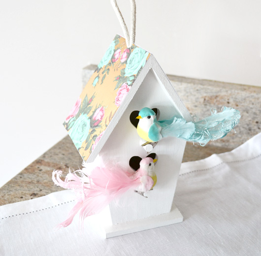Purchase a plain wood birdhouse and embellish with paint, decorative papers and little birdies.